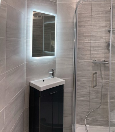 Sink unit, mirror and shower in Ensuite Bathroom installation in a Dublin home - by Clondalkin Gas, Ireland