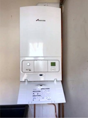 Bosch Greenstar Gas System Boiler with 10 year guarantee installed in the utility room in a Dublin home by Clondalkin Gas